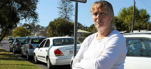 Pratten St resident Debbie Ward wants time restrictions on car parks outside her house. Pratten St resident Debbie Ward wants time restrictions on car parks outside her house.